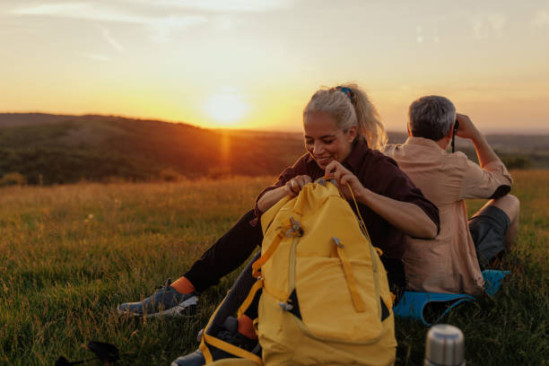 istock Middle age Couple stop for rest after hiking 1399438930