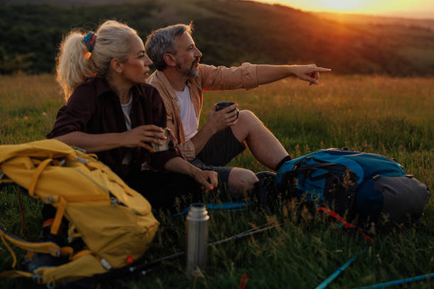 istock Couple drinking coffee in early morning before trekking 1399438938