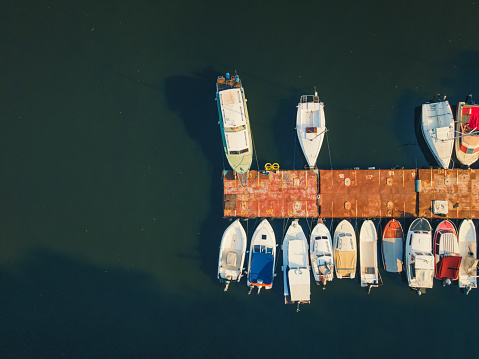 Aerial view of boats moored at the marina on the river