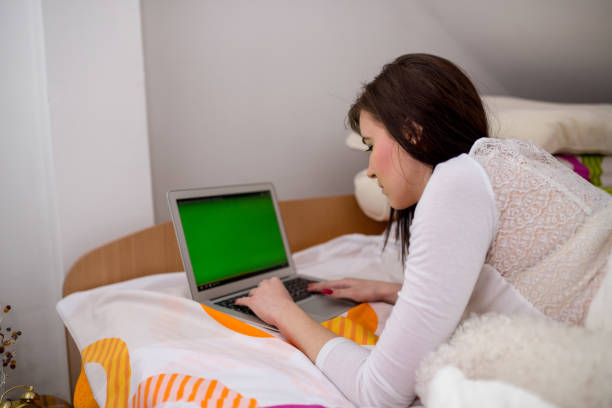 Young woman in a bed.