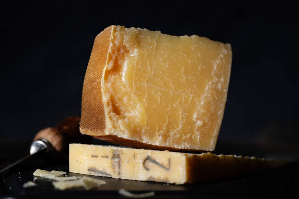 istock Parmesan cheese on wooden board 1399449873
