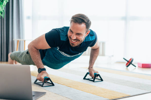 istock Young man exercising at home 1399449918