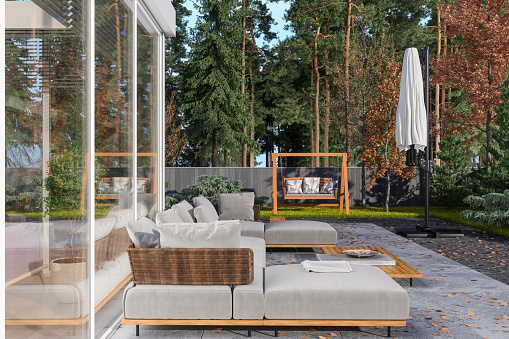 Patio With Corner Sofa, Coffee Table And Garden View