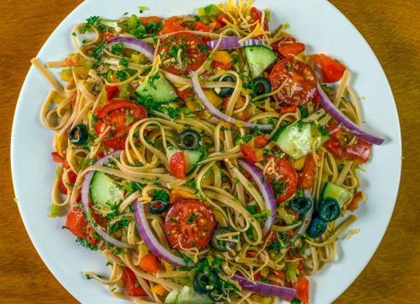istock spaghetti salad with mixed vegetables and top with shreded cheese 1399450261