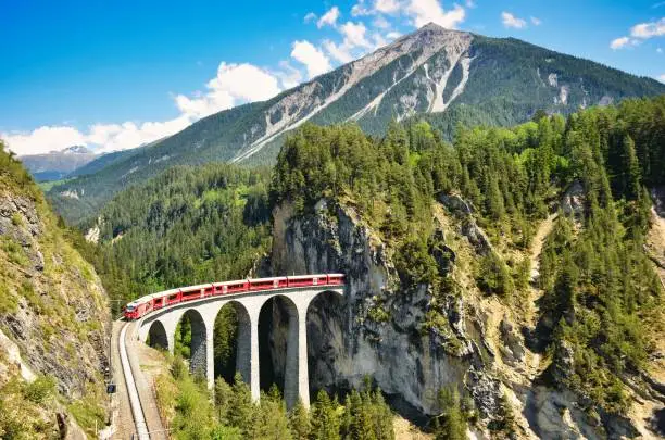 Viaduct in the landwasser valley between davos and filisur. old stone viadukt from a railway. Wiesn in Graubunden