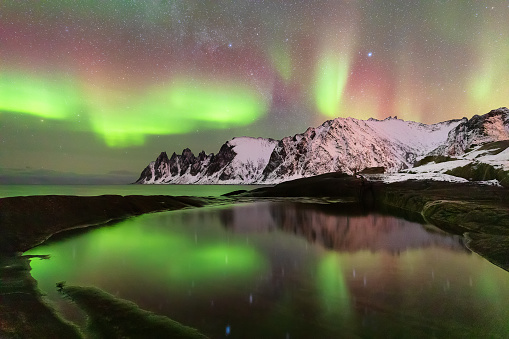 Okshornan Peaks and aurora borealis, Tungeneset at winter night, Senja Island, Norway