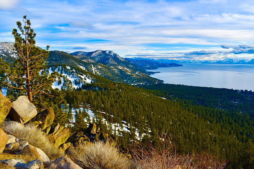 Sunny beautiful Lake Tahoe snowy mountain landscape