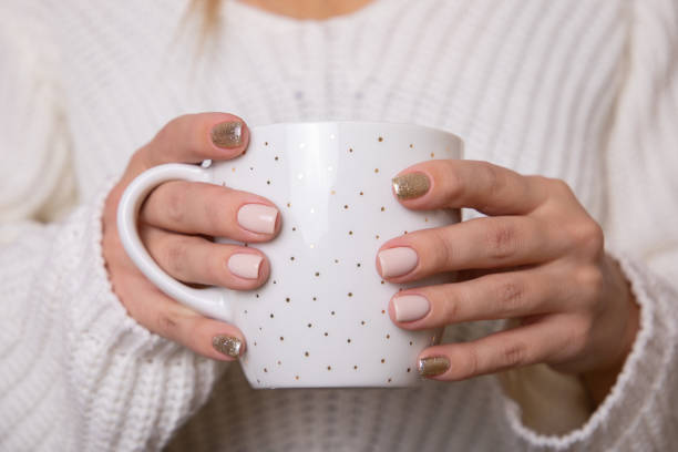 istock Female hands with festive manicure nails 1399460049