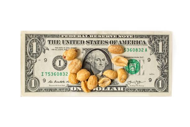 istock Inflation concept with peanuts  on top of a U.S. one dollar bill 1399461690