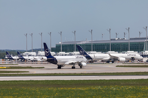 airport, Franz Josef Strauss, Munich,Bavaria, Germany, Mai 2022, some Lufthansa airplanes at there gates at the terminal two