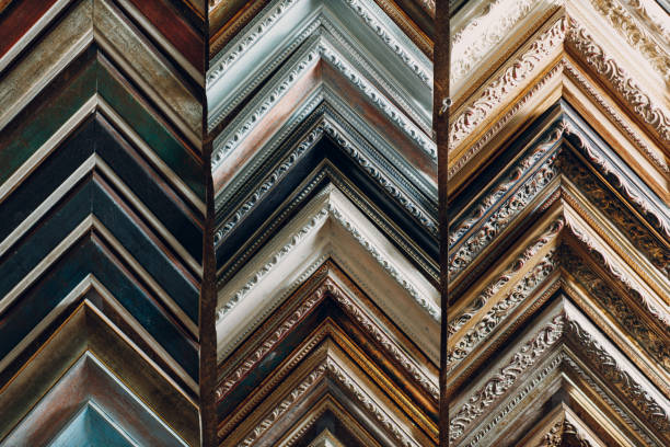 Framing Workshop. Making baguette handmade picture frame at studio Framing Workshop. Many different samples baguette handmade picture frame at studio. hand cropping photos stock pictures, royalty-free photos & images