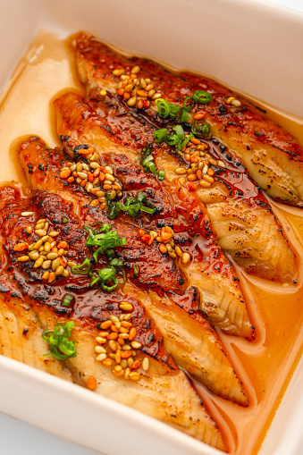 Japanese food sashimi slice of eel in soy sauce.