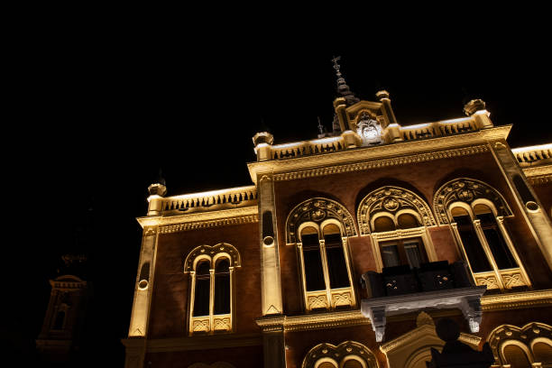 istock Selective blur on Vladicanski Dvor, the Bishop Episcopal palace with its typical Austro hungarian architecture, at night in Novi Sad, Serbia, one of the main landmarks of the city center of Novi Sad. 1399474351