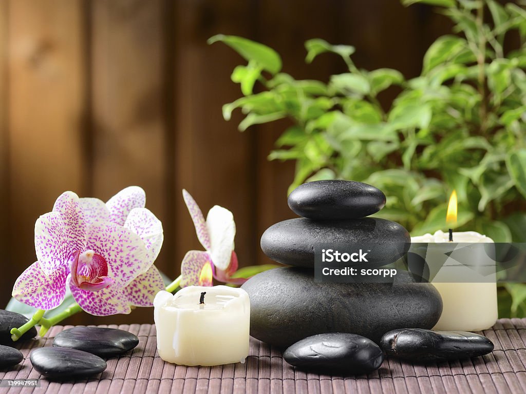 Spa zen basalt stones and orchid on the wood.Others spa teme in this lightbox http://www.istockphoto.com/file_search.php?action=file&lightboxID=7989999 Balance Stock Photo