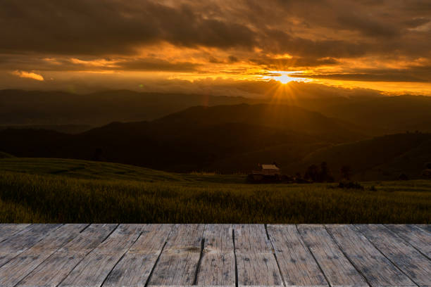 istock Abstract Old Wooden Tabletop Against Rice Terrace At Sunset. 1399479642