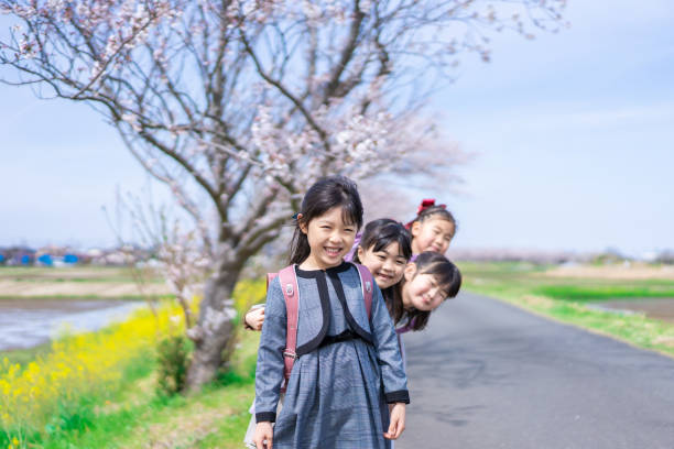 istock Elementary school girls playing on the way to and from school 1399481641