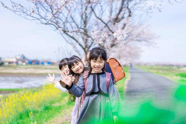 istock Elementary school girls playing on the way to and from school 1399481642