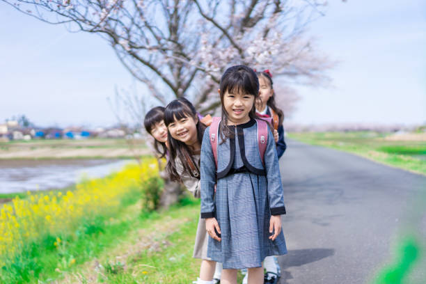 istock Elementary school girls playing on the way to and from school 1399481679