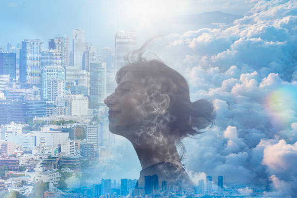 istock a woman's profile, city and sky 1399489426