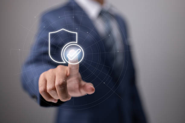 istock Businessman pushing identity proving icon for security protection systems on screen for certified guarantee approval or secure access system idea. Financial assurance for business investment. 1399489543