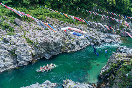 A sightseeing boat in Miyoshi City, Tokushima Prefecture, a carp streamer and a sightseeing boat in Oboke Gorge