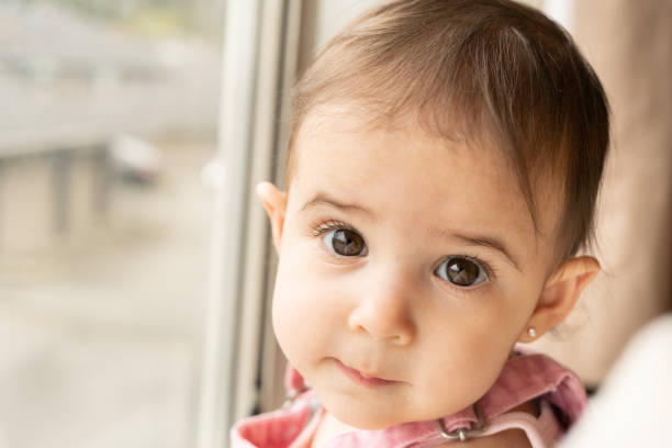 Portrait of baby looking back at camera