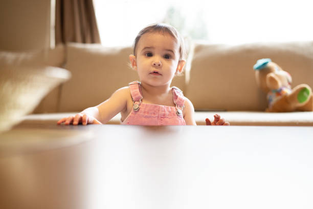 istock Baby on other side of table 1399490298
