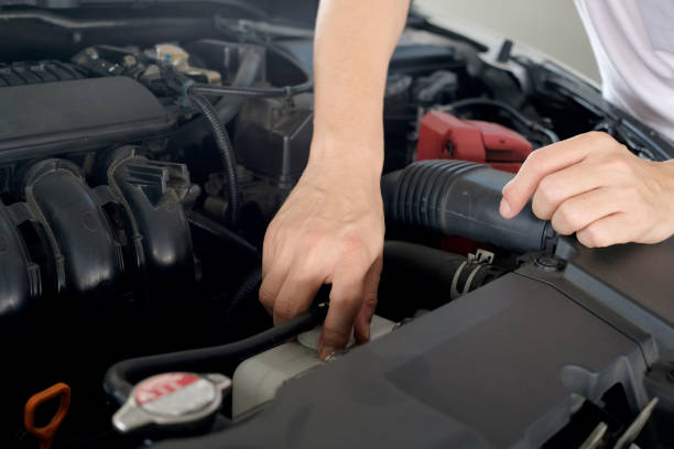 istock Car maintenance technician He is checking the auto engine, car inspection center. 1399491209