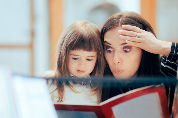 Surprised Mom and Happy Daughter Reading a Book Together