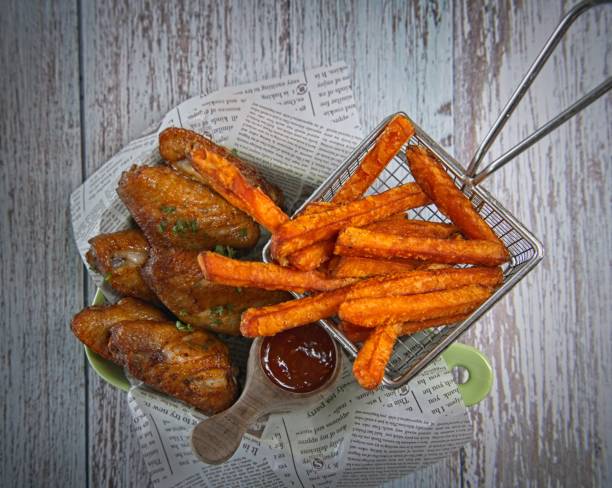 Deep fried chicken wings with batata fries. Simple and tasty finger food.