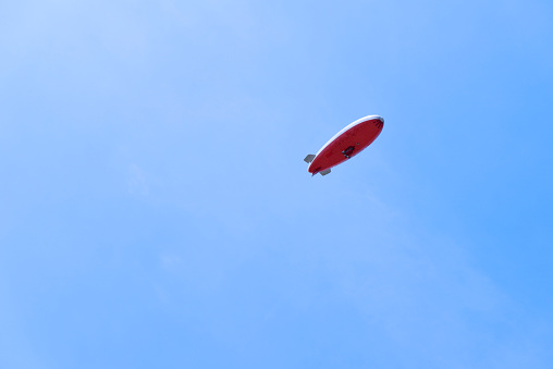 Airship against blue sky with copy space.