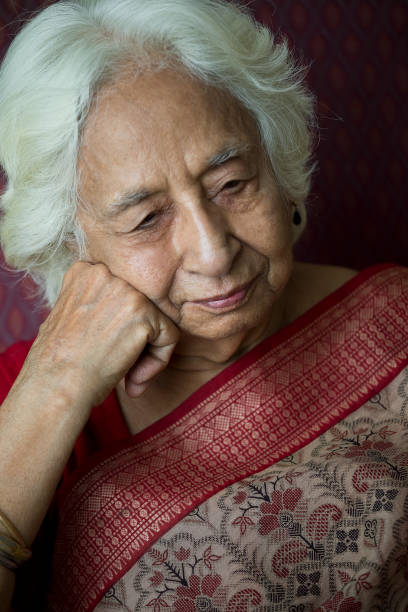 istock Thoughtful old woman sitting on chair 1399497552