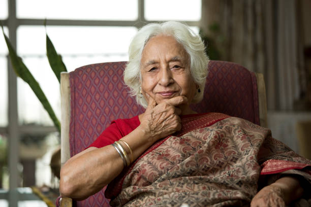 istock Thoughtful old woman sitting on chair 1399497562