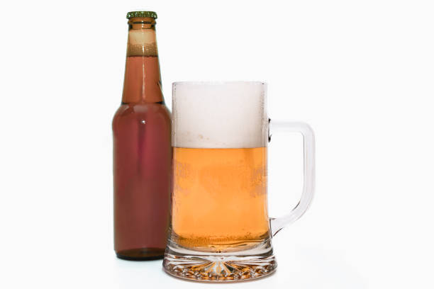 istock Close up of a tempting beer mug with a bottle 1399498396