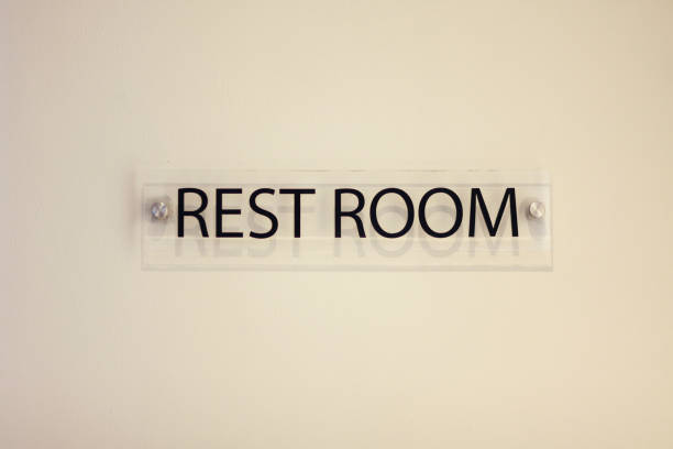 istock Sign shows towards the rest room 1399500008