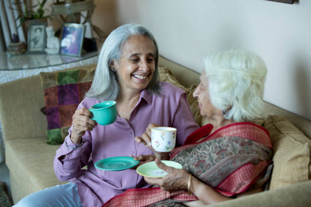 istock Two old women drinking coffee at home 1399501522