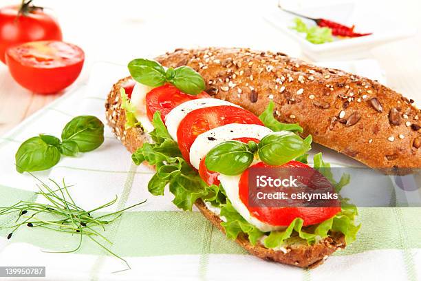 Baguette With Tomato And Mozzarella Stock Photo - Download Image Now - 7-Grain Bread, Baguette, Basil