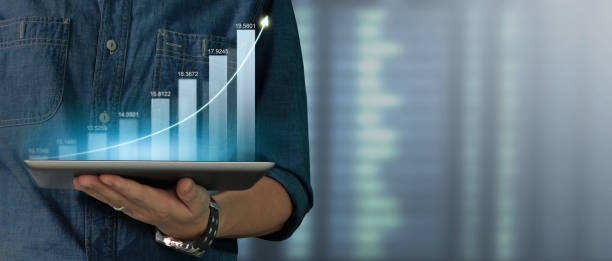 istock Businessman plan graph growth increase of chart positive indicators on tablet in hand 1399508797