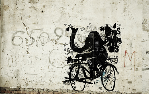 Symbolic image of an elephant riding a bicycle