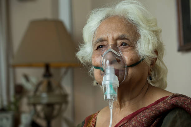 istock Old woman with oxygen mask 1399518368