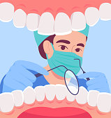 istock Cartoon dentist in mask looking into open mouth of patient 1399518417