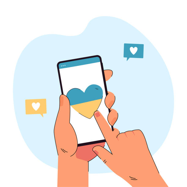 istock Hand holding phone with heart in blue and yellow colors 1399518660