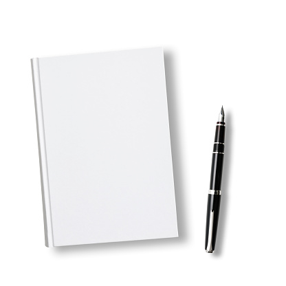 Overhead shot of closed blank book with fountain pen on white background.