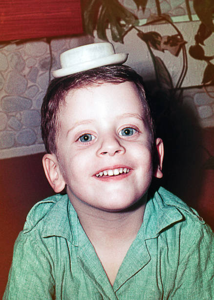 istock Vintage kid portrait with tiny hat on his head 1399521315
