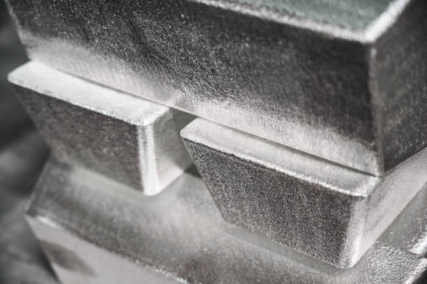 istock Pile of industrial silver bars at bright light in storage 1399521627