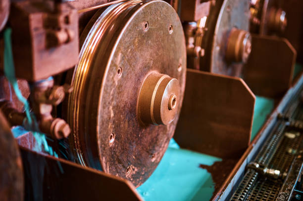 istock Copper wire straightener machine tool in plant workshop 1399521640