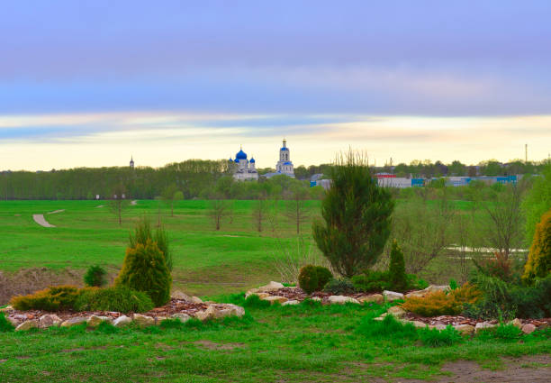Bogolyubov meadow in the morning. Stone lawns, domes of the monastery on the horizon. Bogolyubovo, Vladimir region, Russia, 2022