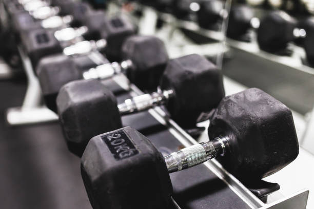 istock Dumbbells on stand in gym 1399523698