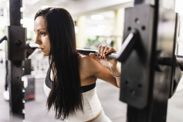 istock Young sporty woman starting squats exercise 1399523721
