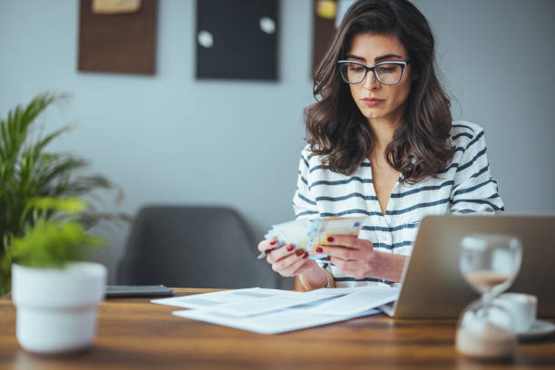 istock Caucasian woman working on finances 1399526317